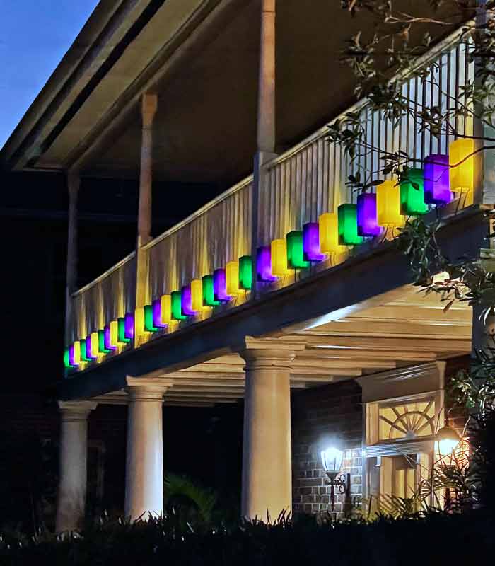 Mardi Gras Luminaries on railing display